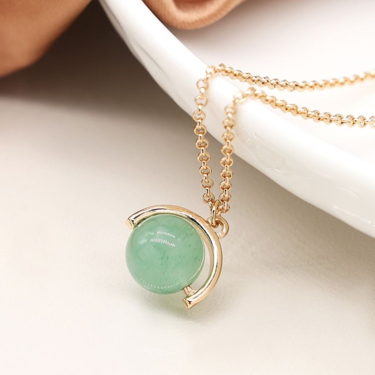 Faux gold suspended green bead pendant on a golden chain