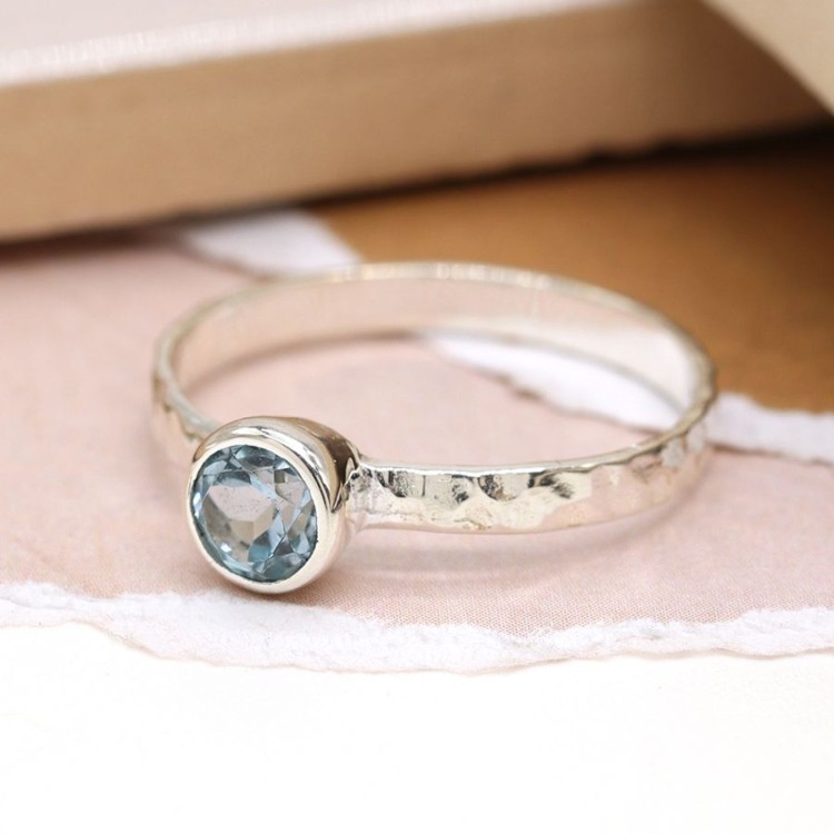 Sterling silver hammered ring with blue topaz